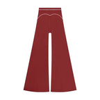 Anointed Garments high-waisted wide-leg trousers in deep red with white contrast piping detail.