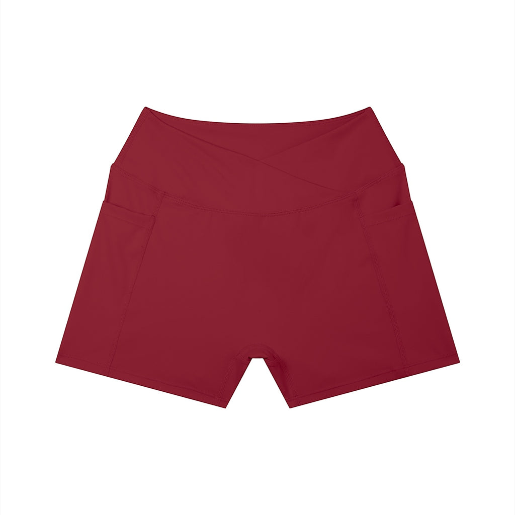 Anointed Garments high-rise yoga shorts in deep red with side pockets and a flattering crossover waistband.