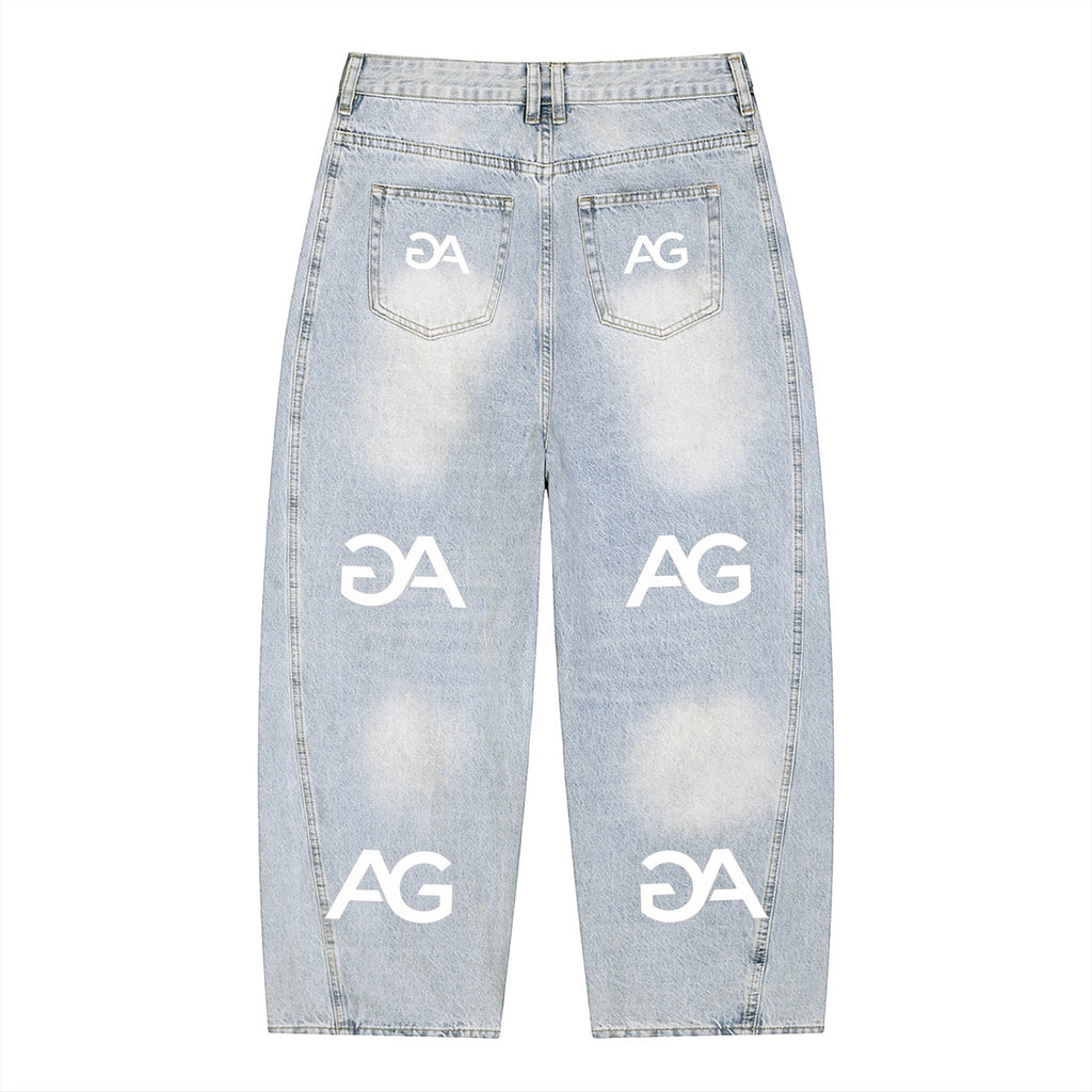 Anointed Garments relaxed fit light-wash denim jeans with repeating white AG logo print and wide-leg silhouette