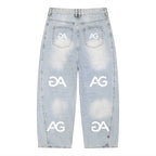 Anointed Garments relaxed fit light-wash denim jeans with repeating white AG logo print and wide-leg silhouette