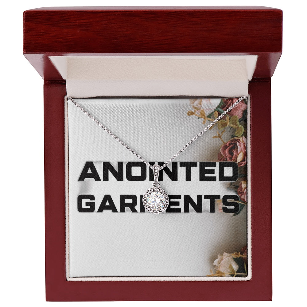 Anointed Garments round halo pendant necklace with cubic zirconia crystals in a wooden gift box.
