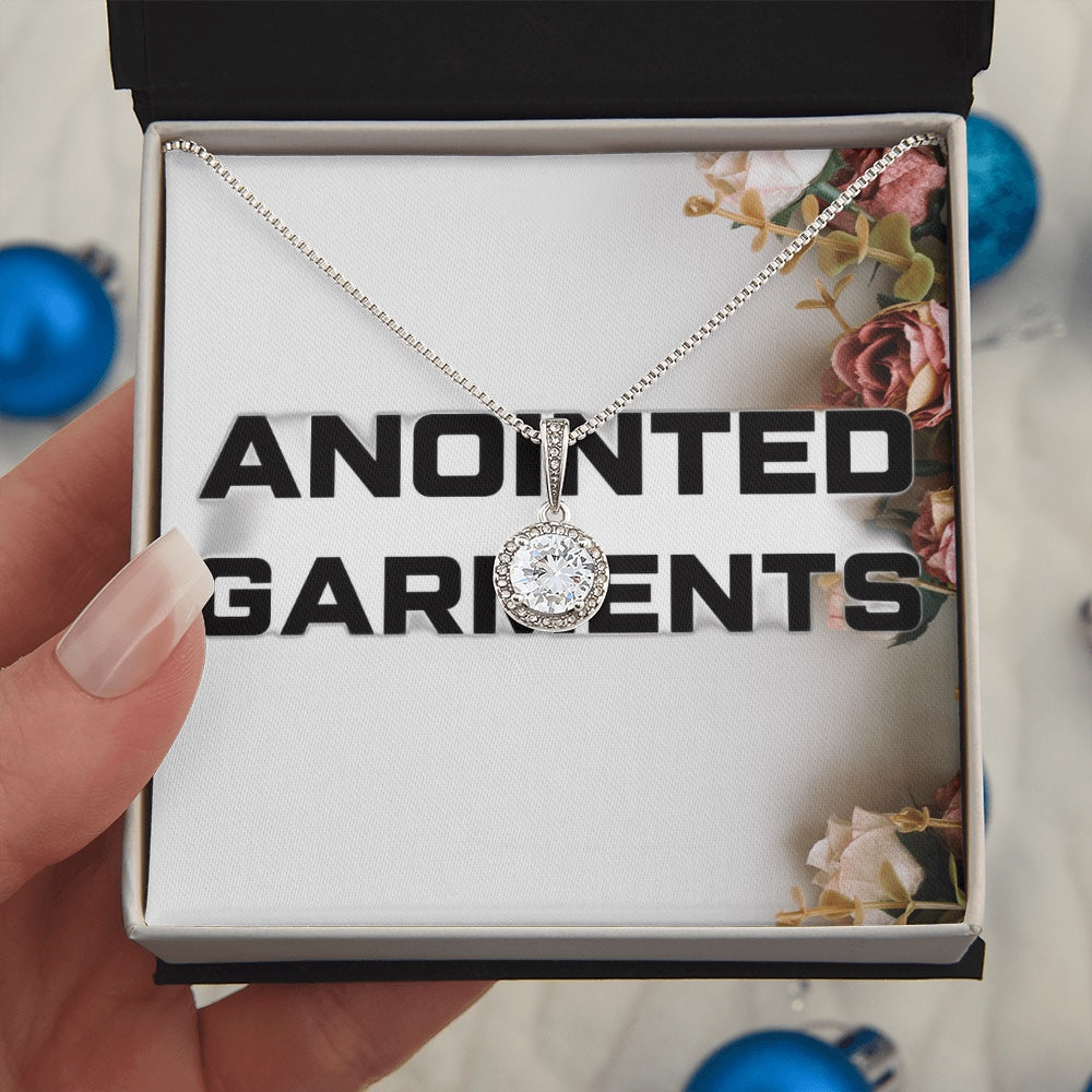 Anointed Garments round halo pendant necklace with a central cubic zirconia crystal in a white gold finish box
