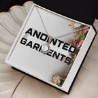 Anointed Garments round halo pendant necklace with cubic zirconia crystals on a silver-tone chain in a gift box.