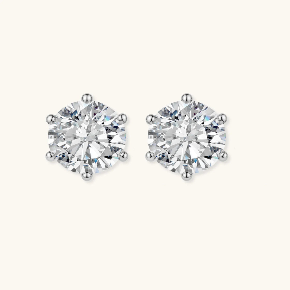 Anointed Garments Brilliant Moissanite Studs featuring 0.5-carat round-cut stones in platinum-plated sterling silver.