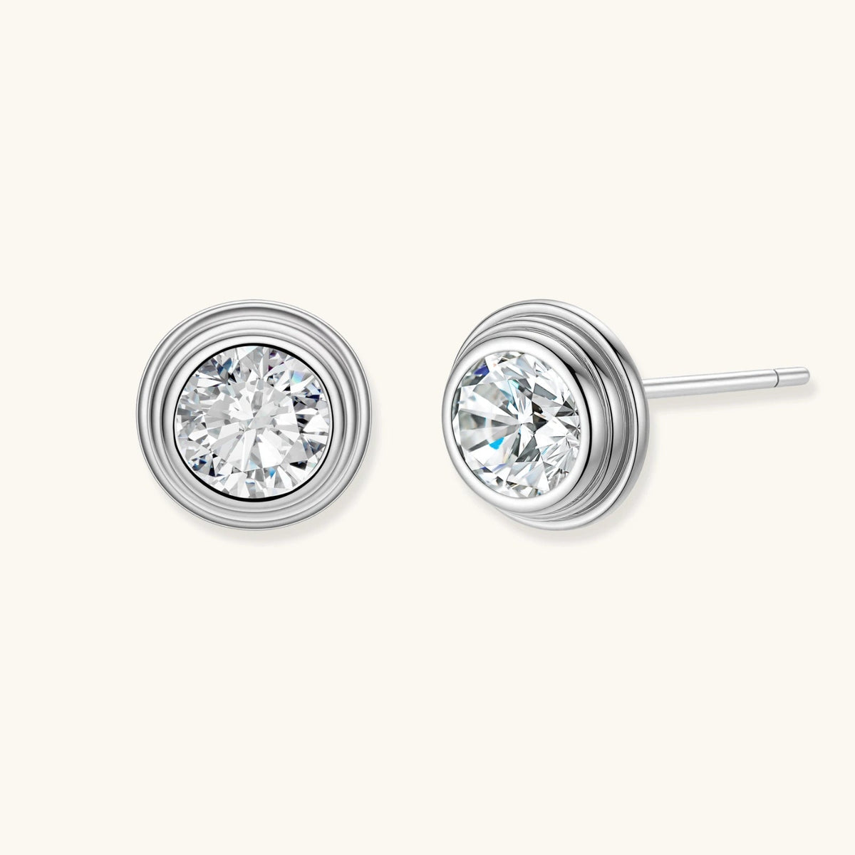 Anointed Garments round moissanite stud earrings in platinum-plated 925 sterling silver with concentric circle design.