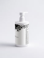 Anointed Garments Anointed Skin sensitive face and body cleanser in a white pump bottle against a neutral background.