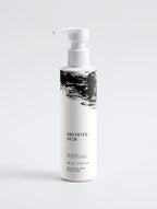 Anointed Garments Anointed Skin Sensitive Skin Face & Body Cream in a white pump bottle with black abstract design.