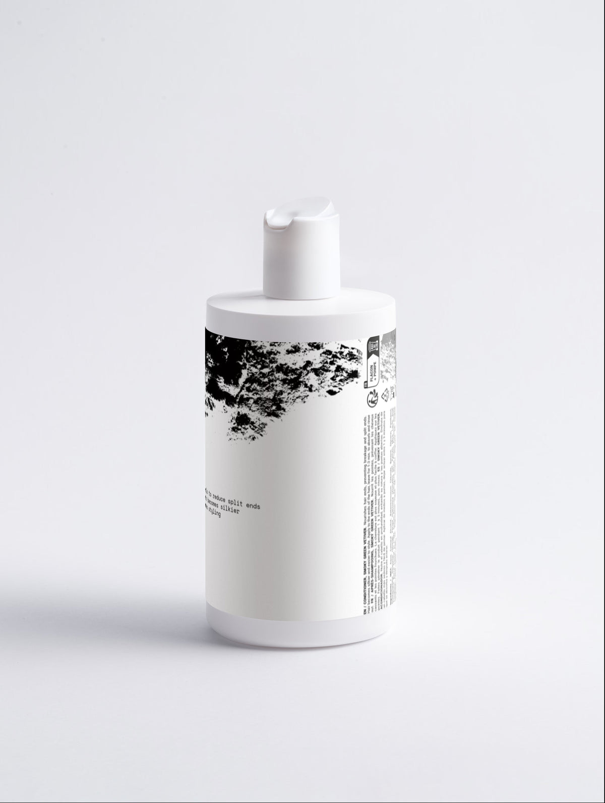 Anointed Garments Silk Repair Hair Conditioner in a white bottle with black text and abstract graphic design.