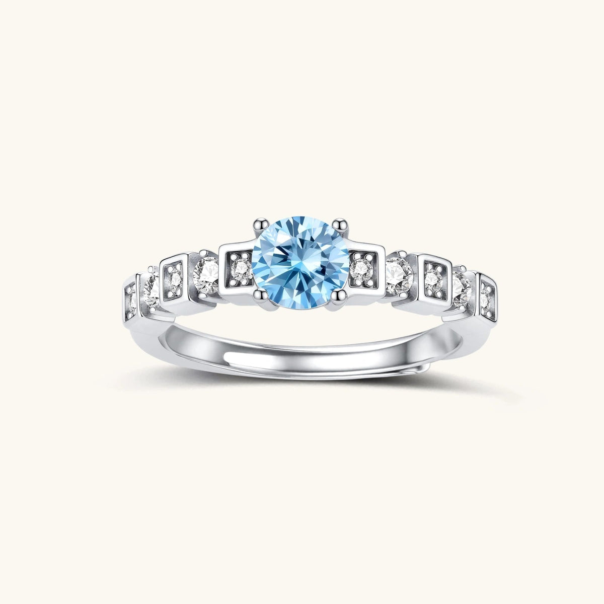 Anointed Garments Skyline Moissanite Ring featuring a round light blue stone in a platinum-plated sterling silver band.