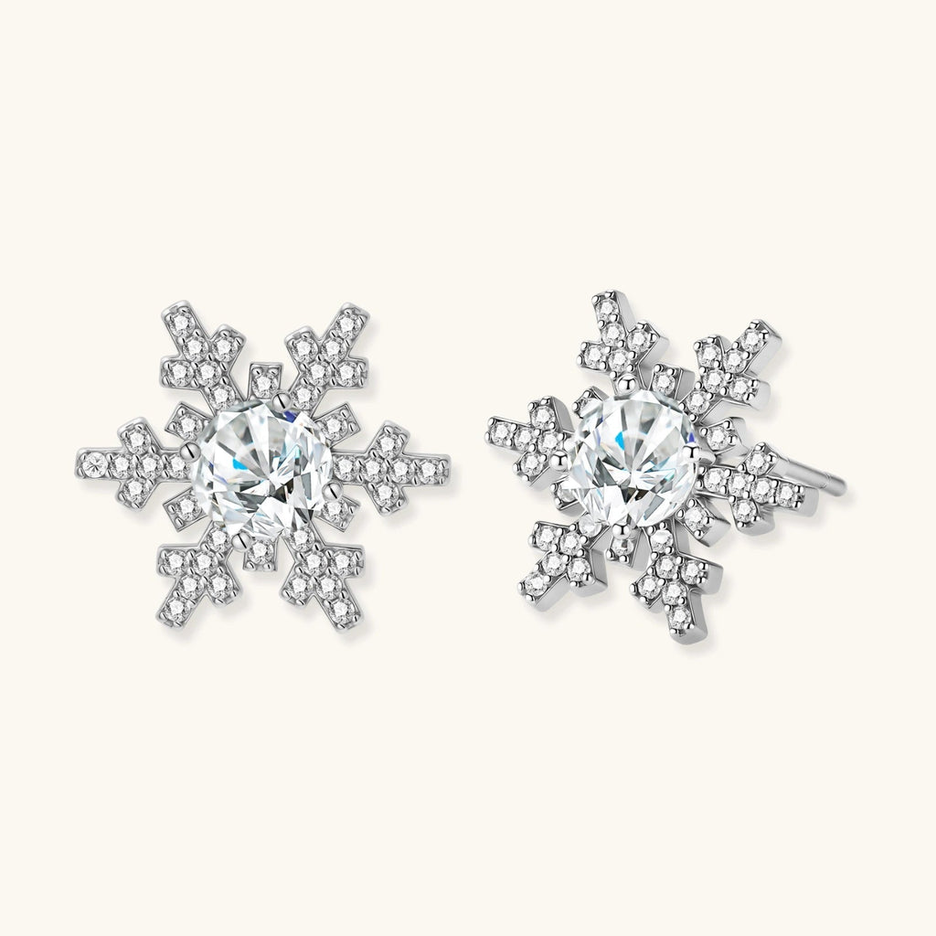 Anointed Garments Winter Spark Studs featuring round moissanite stones in platinum-plated sterling silver snowflakes.