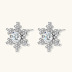 Anointed Garments Winter Spark Studs featuring round-cut moissanite in a platinum-plated sterling silver snowflake design.