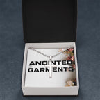 Anointed Garments stainless steel cross pendant necklace on a ball chain inside an elegant branded gift box