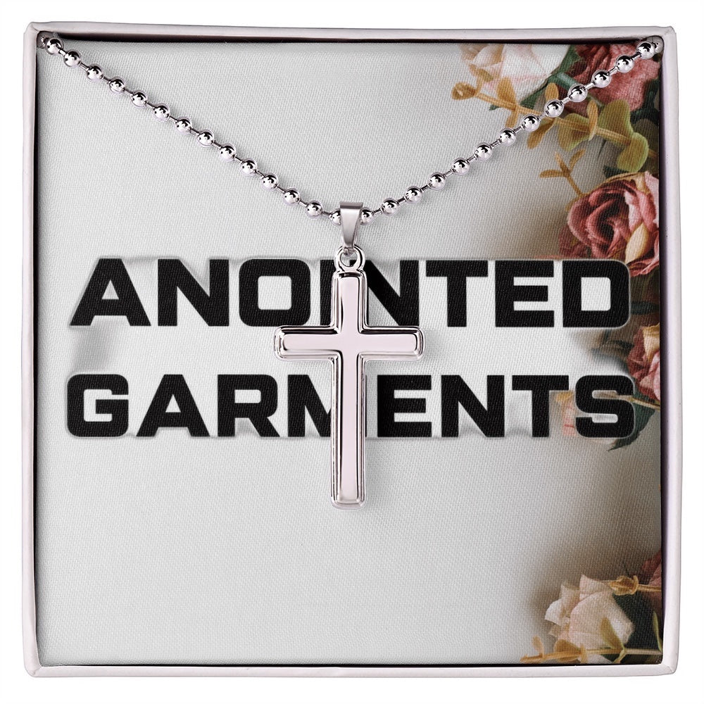 Anointed Garments classic polished stainless steel cross pendant on a ball chain inside a decorative gift box.