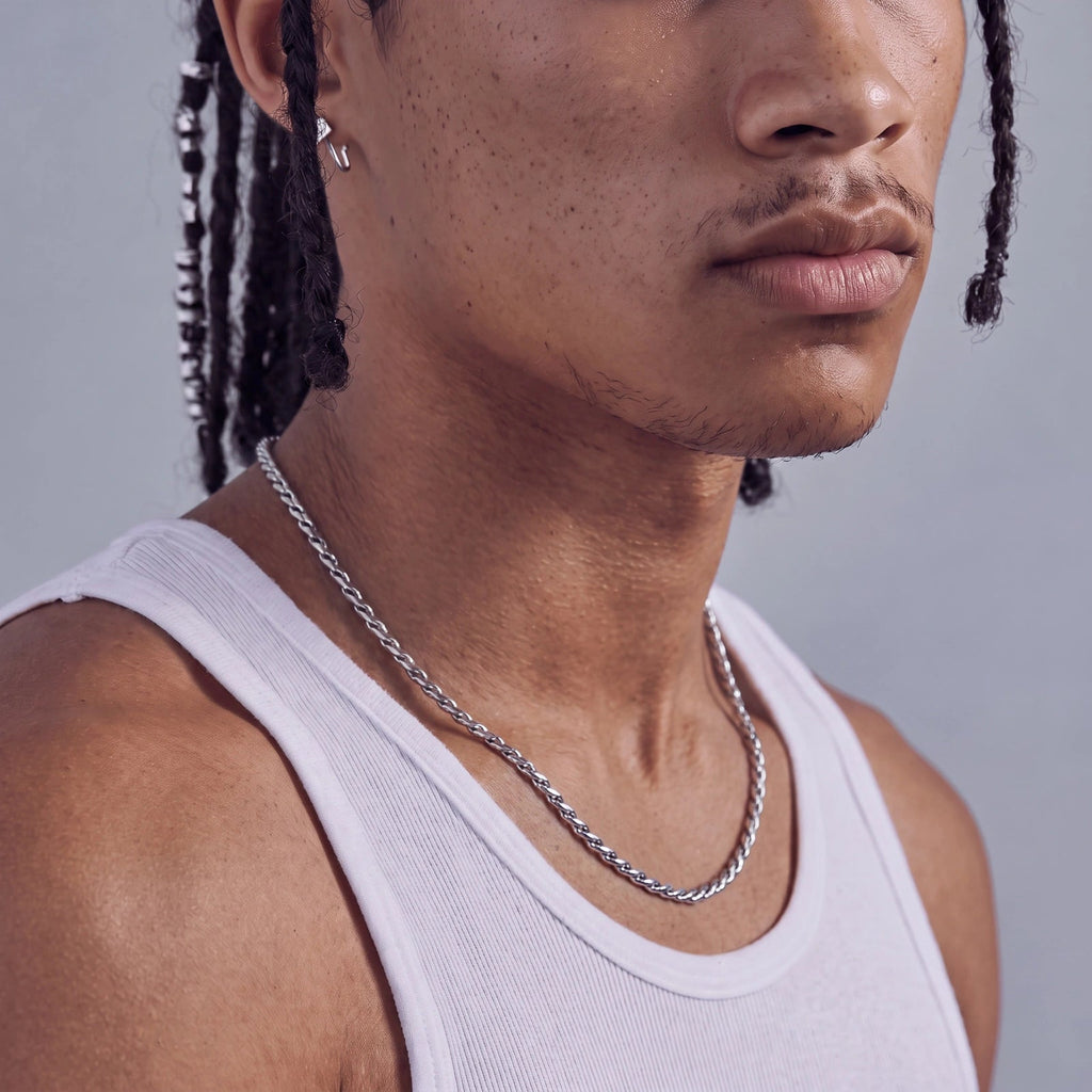 Anointed Garments polished stainless steel twisted rope chain worn by a man in a white tank top