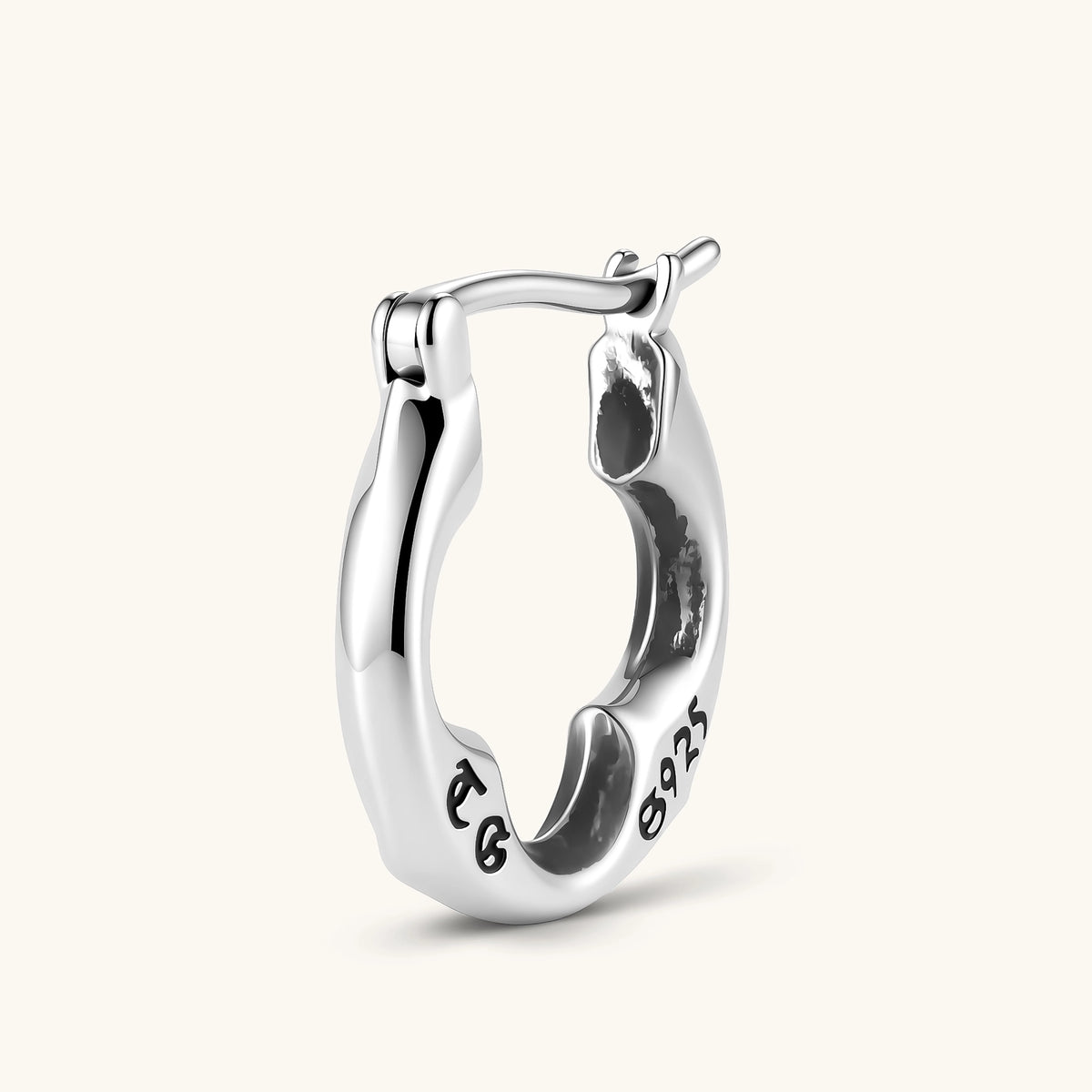Anointed Garments sterling silver clover hoop earring with a polished finish, shown from a side angle.