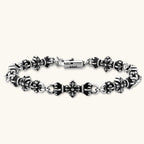 Anointed Garments sterling silver cross relic bracelet with a dark oxidized finish and intricate gothic link design.