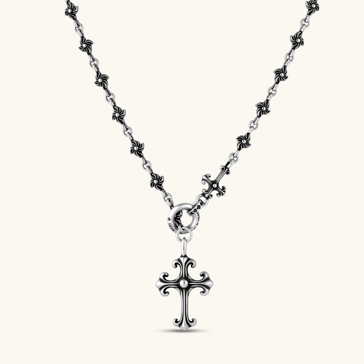 Anointed Garments sterling silver gothic cross necklace with an ornate fleur-de-lis pendant and floral chain links.