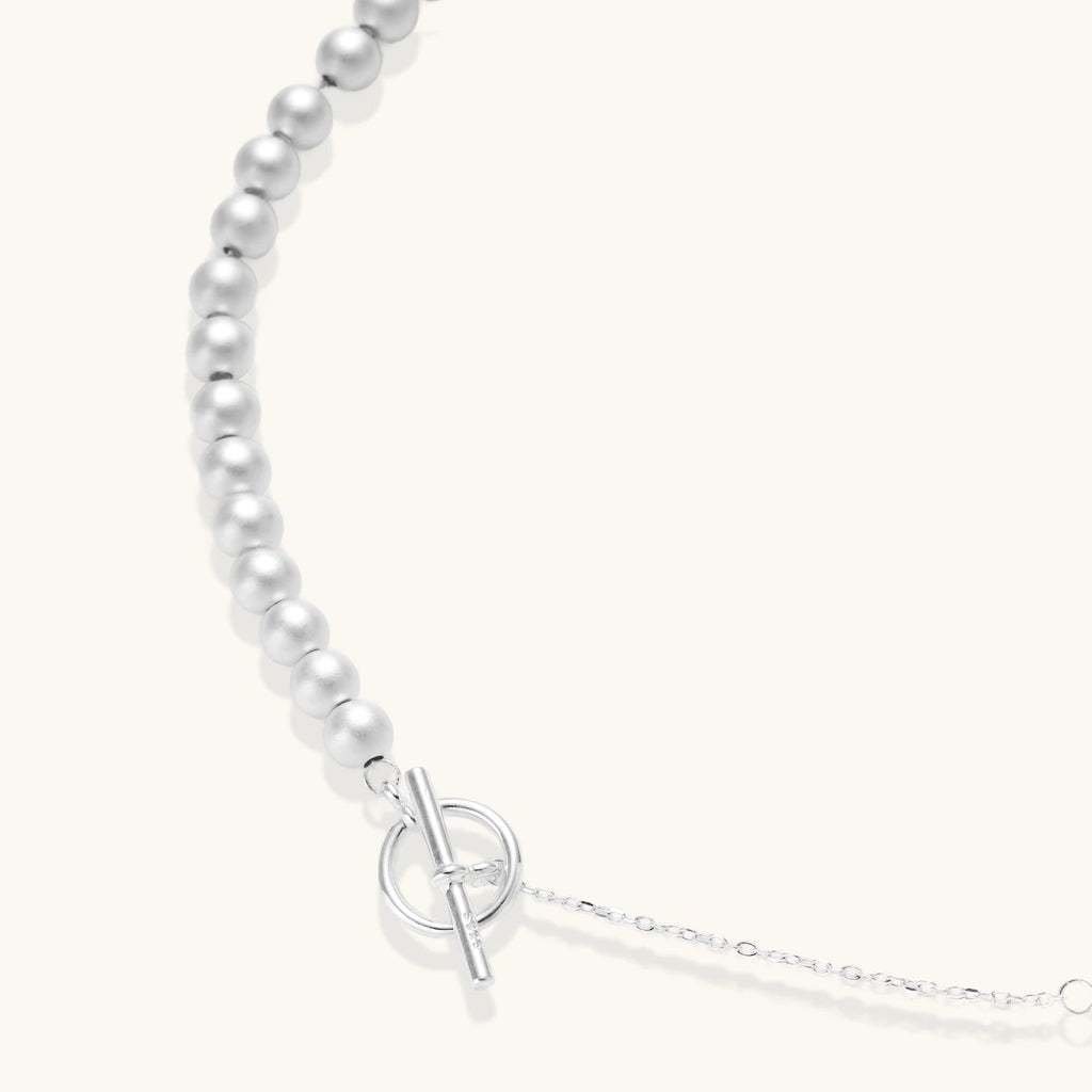 Anointed Garments sterling silver necklace with graduated polished spheres and a toggle clasp on a light background.