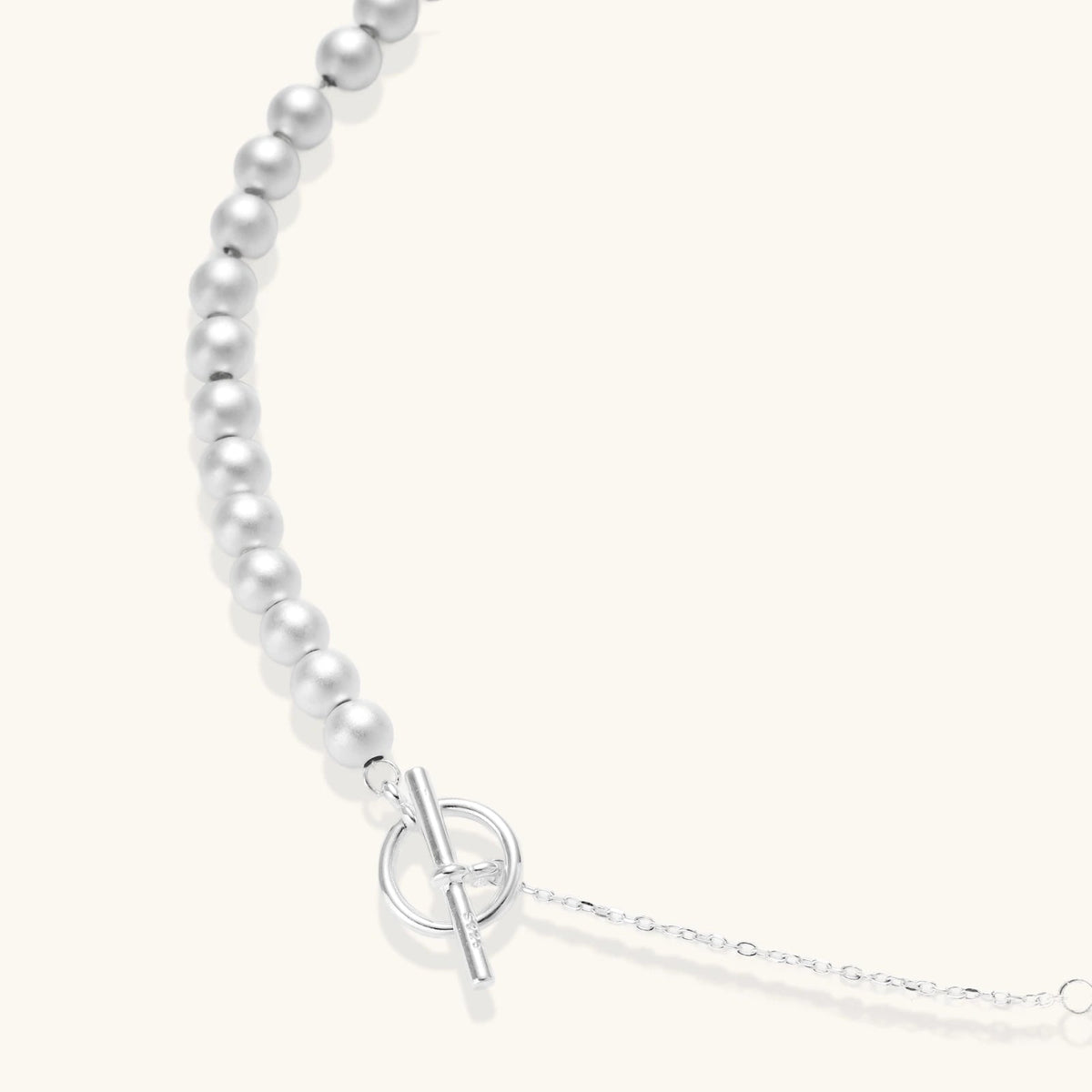 Anointed Garments sterling silver necklace with graduated polished spheres and a toggle clasp on a light background.