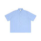 Anointed Garments light blue and white striped boxy short sleeve button-down shirt with a chest pocket.