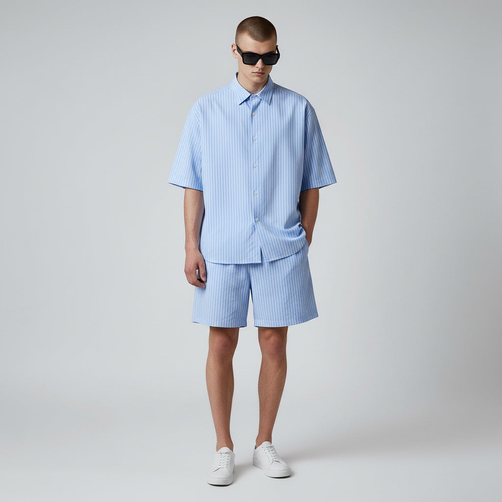 Anointed Garments light blue and white striped lounge shorts worn by a model with a matching short-sleeve shirt.