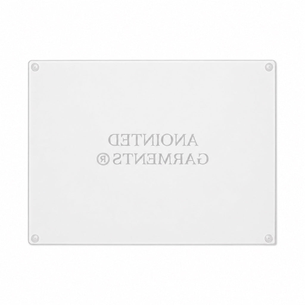 Anointed Garments tempered glass cutting board with a rectangular shape and a whorled-texture surface.