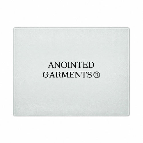 Anointed Garments rectangular tempered glass cutting board with a whorled texture and centered brand logo.