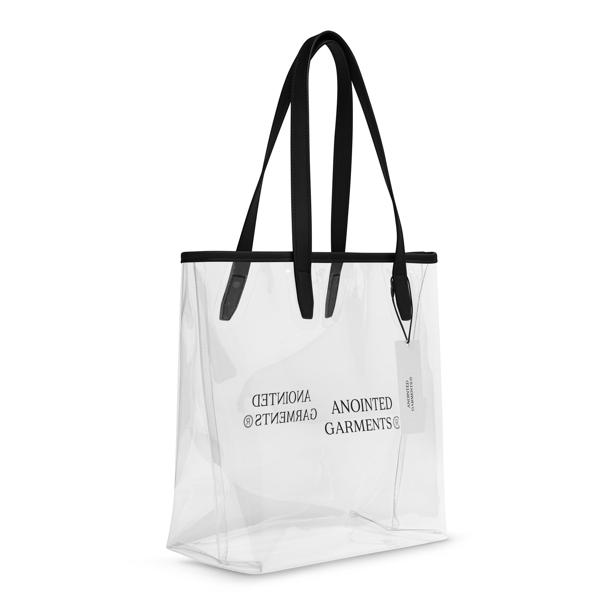 Anointed Garments transparent TPU tote bag with black trim and shoulder straps, featuring minimalist branding.