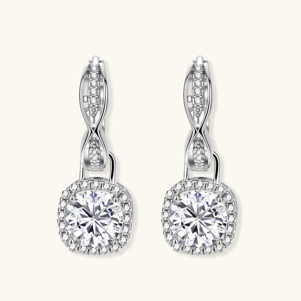 Anointed Garments twisted infinity halo moissanite earrings in platinum-plated 925 sterling silver with round-cut stones.