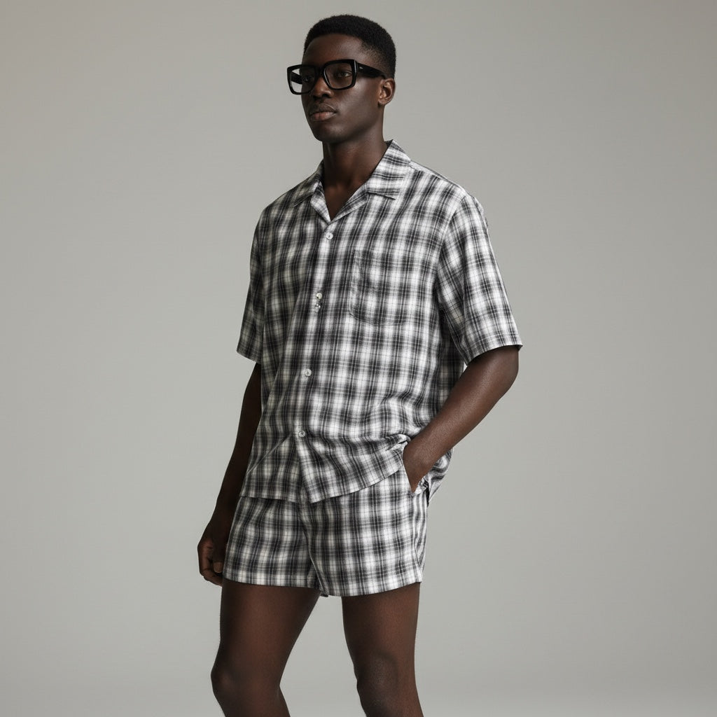 Anointed Garments unisex plaid shorts and matching shirt set in black and white, featuring a casual summer style.