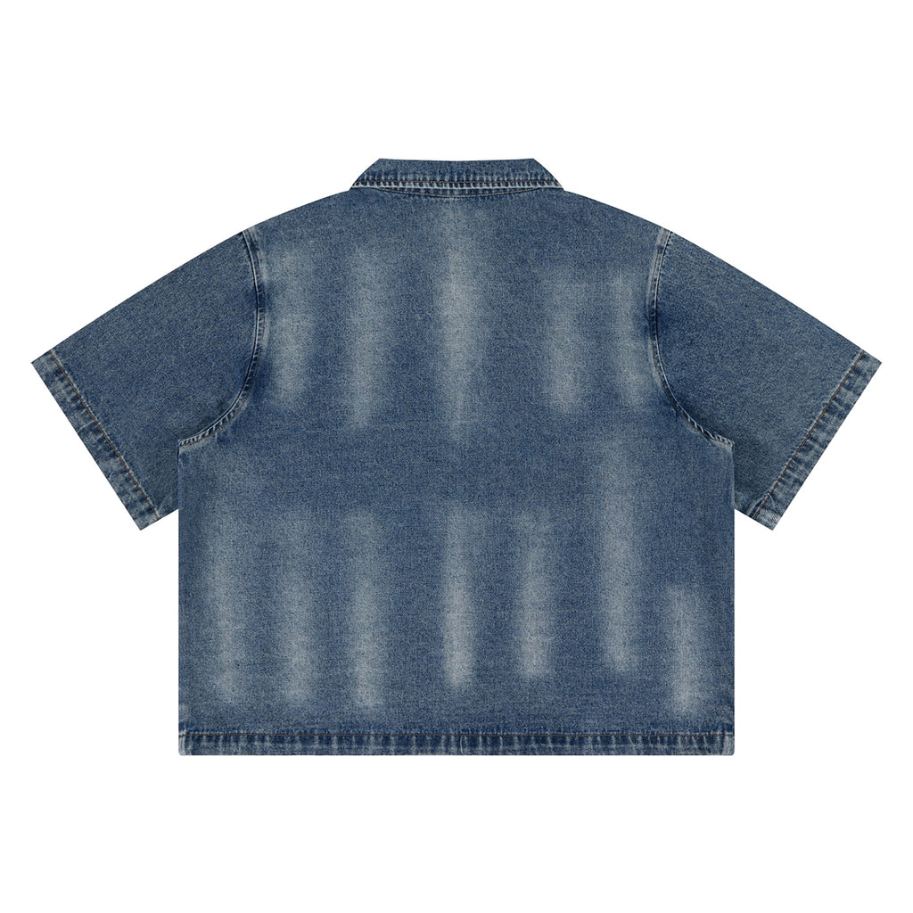Anointed Garments unisex vintage washed blue denim shirt with a drop shoulder and short sleeves, back view.