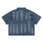 Anointed Garments unisex vintage washed blue denim shirt with a drop shoulder and short sleeves, back view.