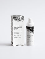 Anointed Garments Anointed Skin Vitamin C serum bottle and box with black and white textured design on white background
