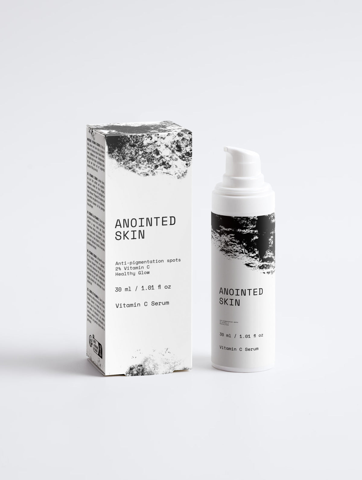 Anointed Garments Anointed Skin Vitamin C serum bottle and box with black and white textured design on white background