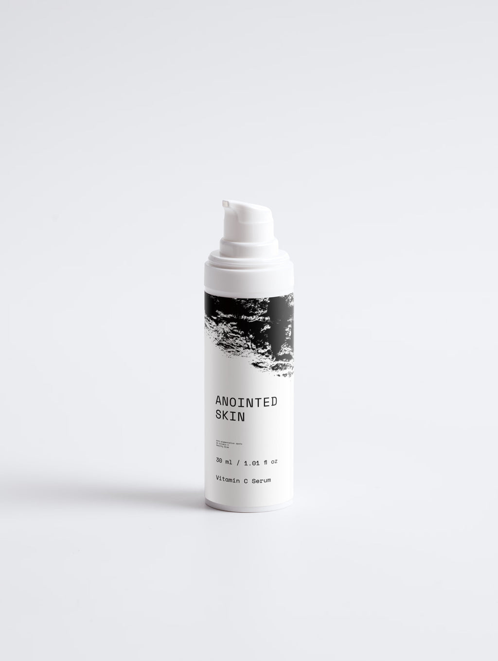 Anointed Garments Anointed Skin Vitamin C serum bottle with white pump dispenser and black and white label design