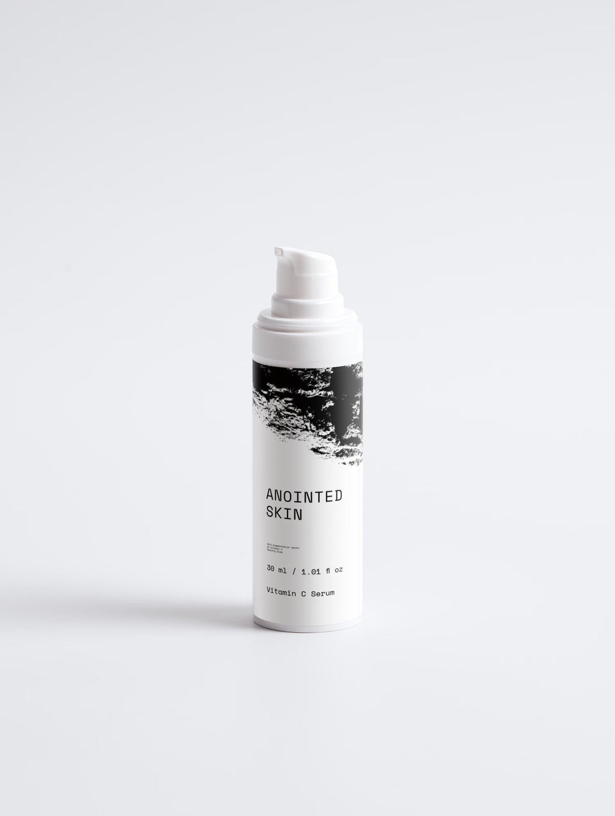 Anointed Garments Anointed Skin Vitamin C serum bottle with white pump dispenser and black and white label design