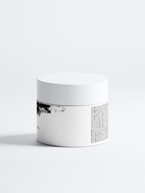 Anointed Garments Icelandic Volcano face and body scrub in a white jar with black volcanic sand graphic design