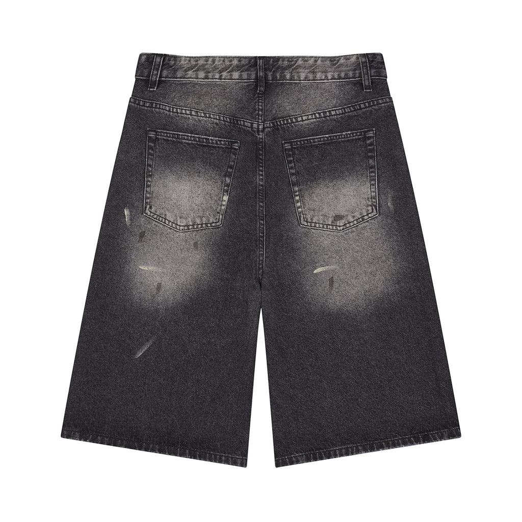 Anointed Garments wide leg denim shorts in washed black with distressed detailing and five-pocket styling, back view.