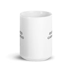 Anointed Garments white glossy ceramic mug with black branding on a clean white background