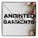 Anointed Garments white gold finish heart infinity necklace on a cable chain in a floral gift box.