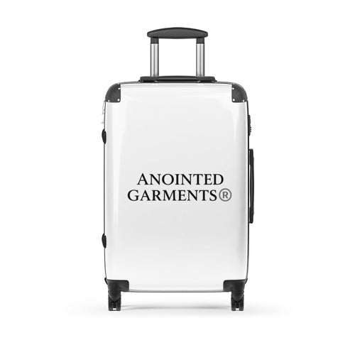 Anointed Garments white hardshell rolling suitcase with black trim, spinner wheels, and telescopic handle