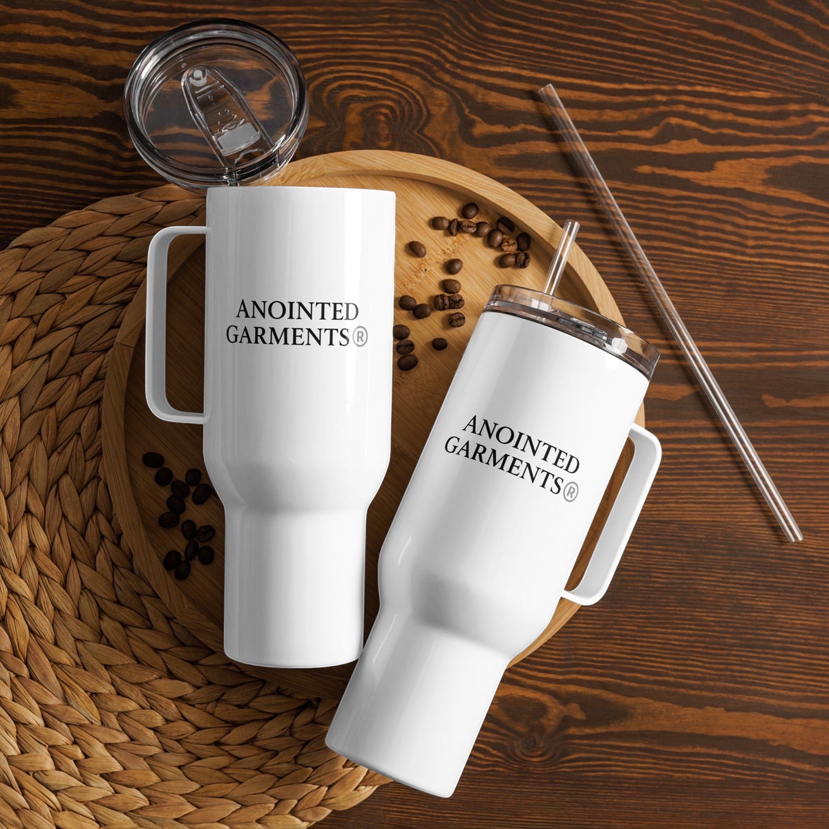 Two white Anointed Garments 40 oz stainless steel insulated tumblers with handles, lids, and straws on a wooden tray.