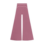 Anointed Garments high-waisted wide-leg trousers in dusty rose with white contrast piping detail.