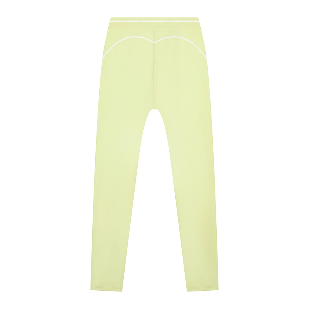 Anointed Garments high-waisted performance athletic leggings in pale yellow with white contrast piping details.