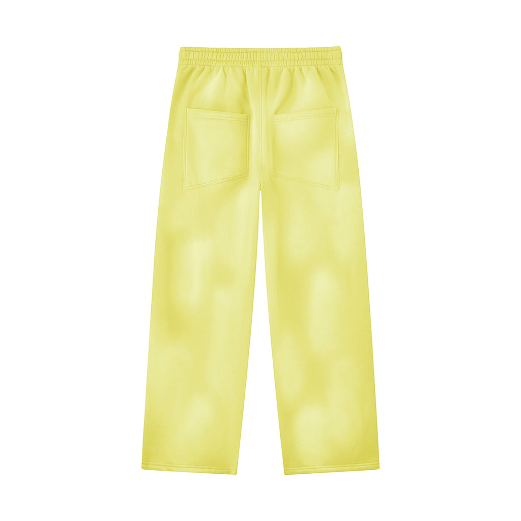 Back view of Anointed Garments relaxed fit yellow fleece sweatpants with back pockets and elastic waistband.