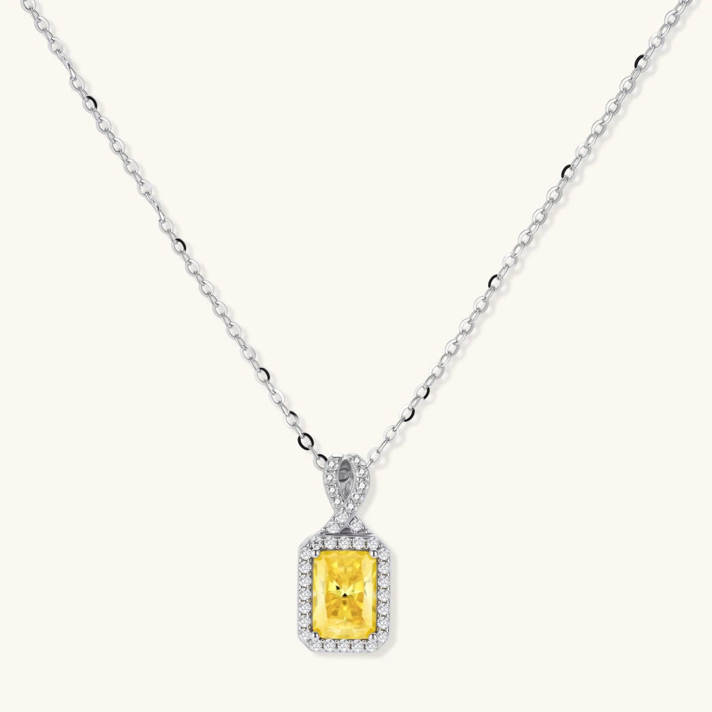 Anointed Garments necklace featuring a radiant yellow rectangular moissanite pendant in a platinum-plated sterling silver halo setting.