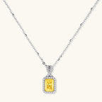 Anointed Garments necklace featuring a radiant yellow rectangular moissanite pendant in a platinum-plated sterling silver halo setting.