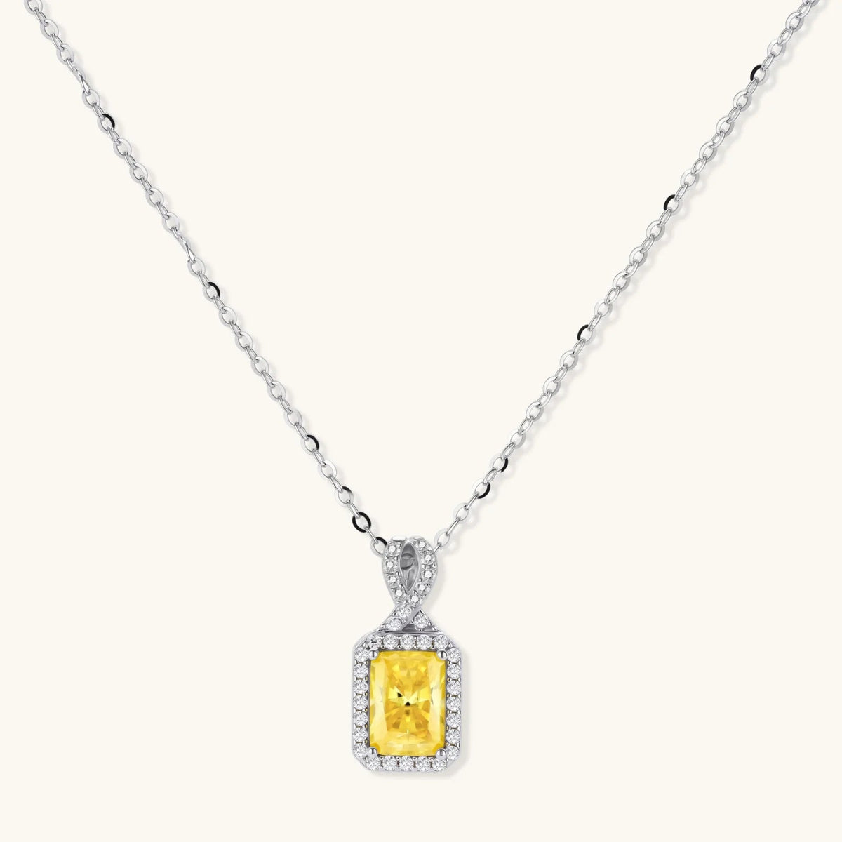 Anointed Garments necklace featuring a radiant yellow rectangular moissanite pendant in a platinum-plated sterling silver halo setting.