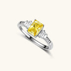 Anointed Garments Sunset Sovereign ring featuring a yellow moissanite stone in a platinum-plated sterling silver band.