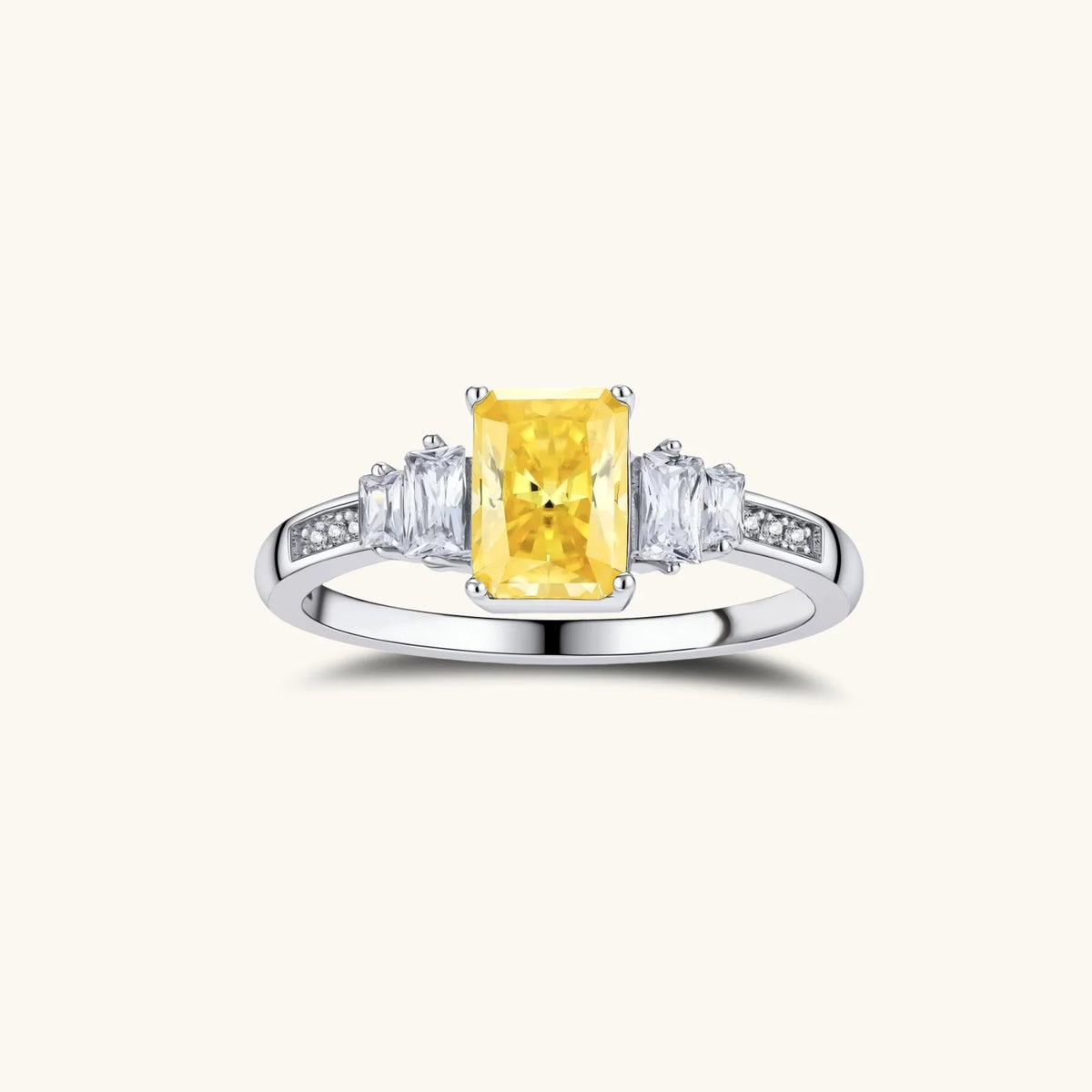 Anointed Garments platinum-plated sterling silver ring featuring a radiant yellow rectangular moissanite center stone.